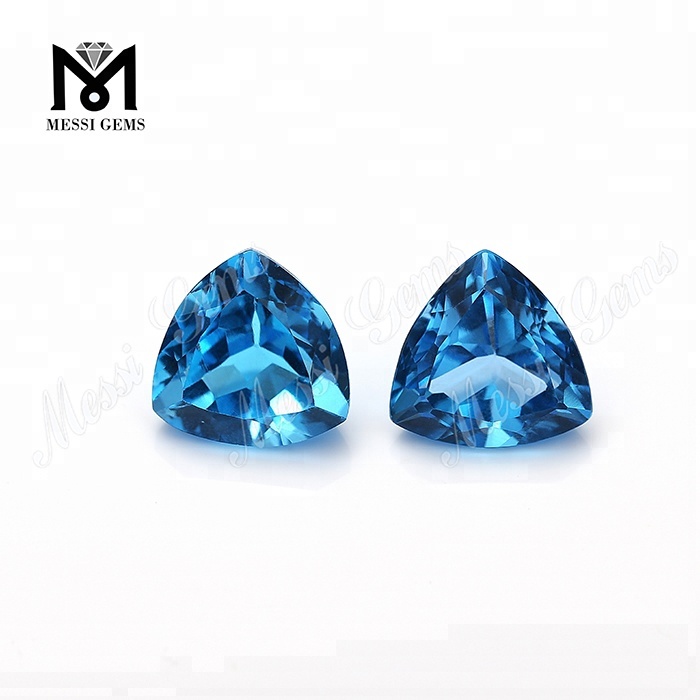 Preço de fábrica cristal azul qualidade superior trilhão forma pedra preciosa topázio azul natural